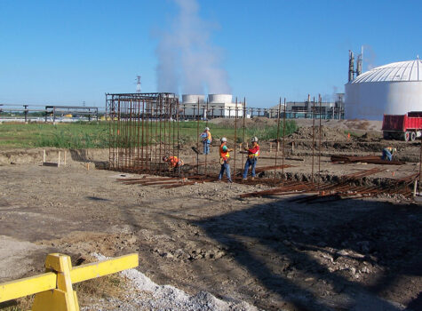 Workers placing rebar for a foundation