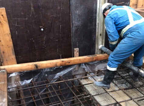 Man in safety gear standing on rebar