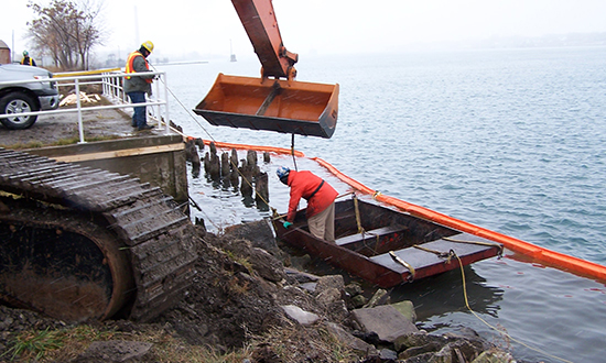 Man in a barge working in the water